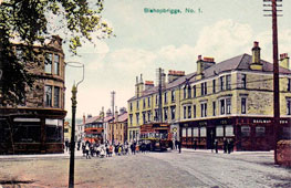 Bishopbriggs. Panorama of town street with tram